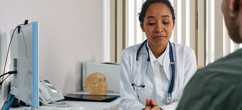 a man talking to a doctor