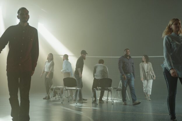 people leaving a group therapy session