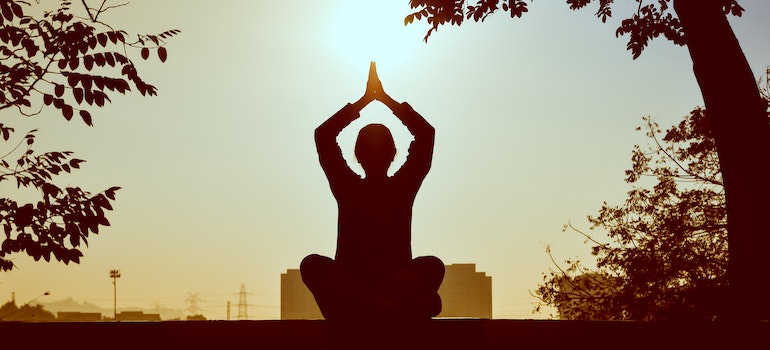 Person doing yoga during addiction recovery.