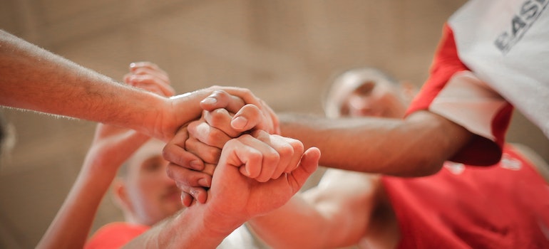 people holding hands together