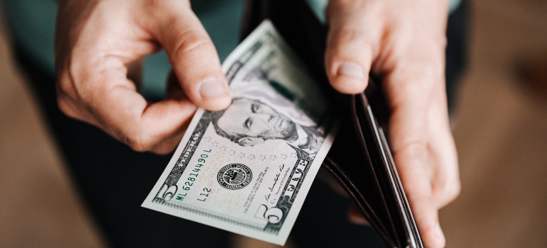 person holding a wallet