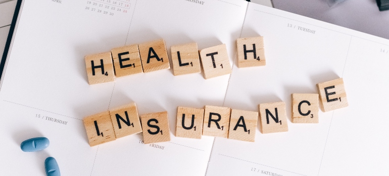 blocks spelling "health insurance"