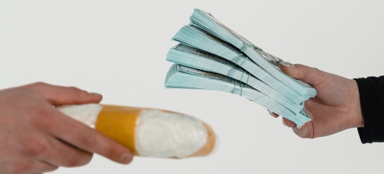 person paying for their crack cocaine addiction