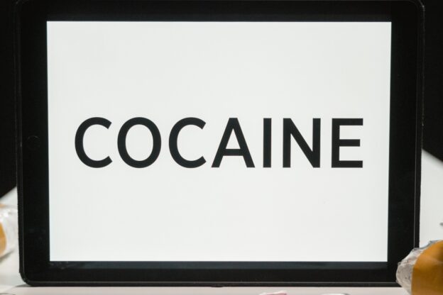 white board with the word "cocaine" on it