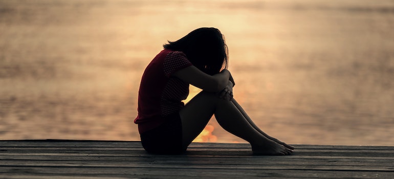 A person experiencing an anxiety attack on the beach