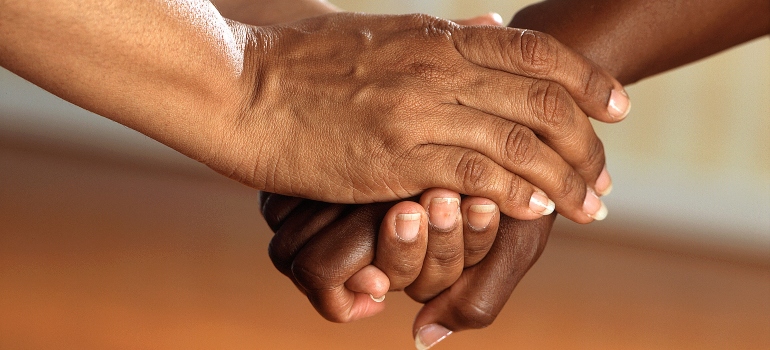 three hands joined together