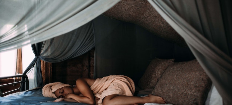 woman lying in her bed