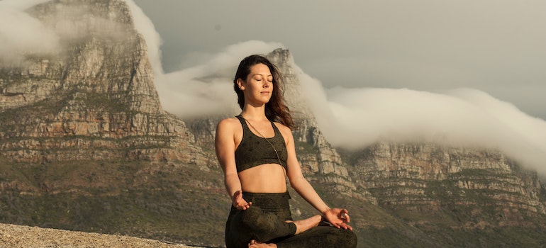 a woman thinking about emotional wellness in recovery