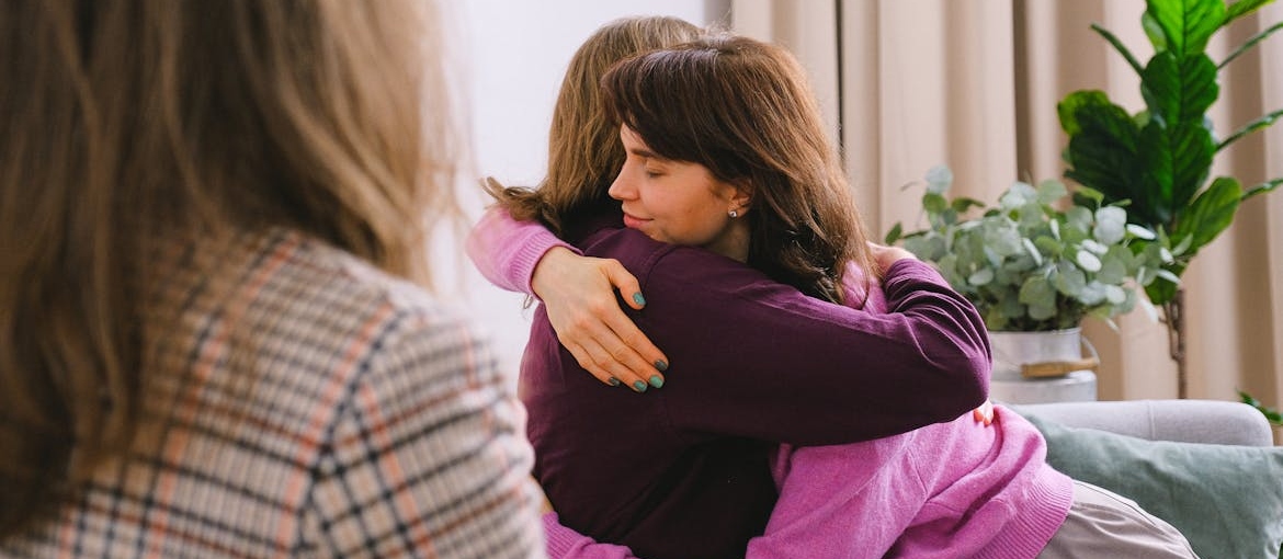 Couple hugging during couples therapy.
