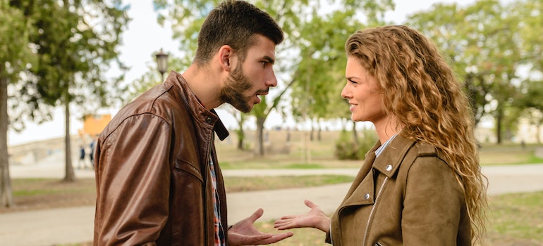 a couple fighting in the park