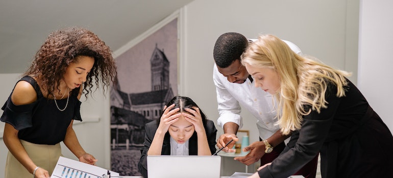 Woman suffering from social anxiety disorder being surrounded by people