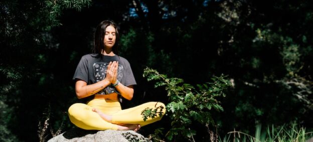 Woman meditating representing holistic approaches to addiction treatment