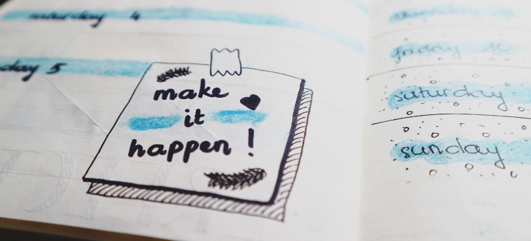 a calendar with a "make it happen" note,