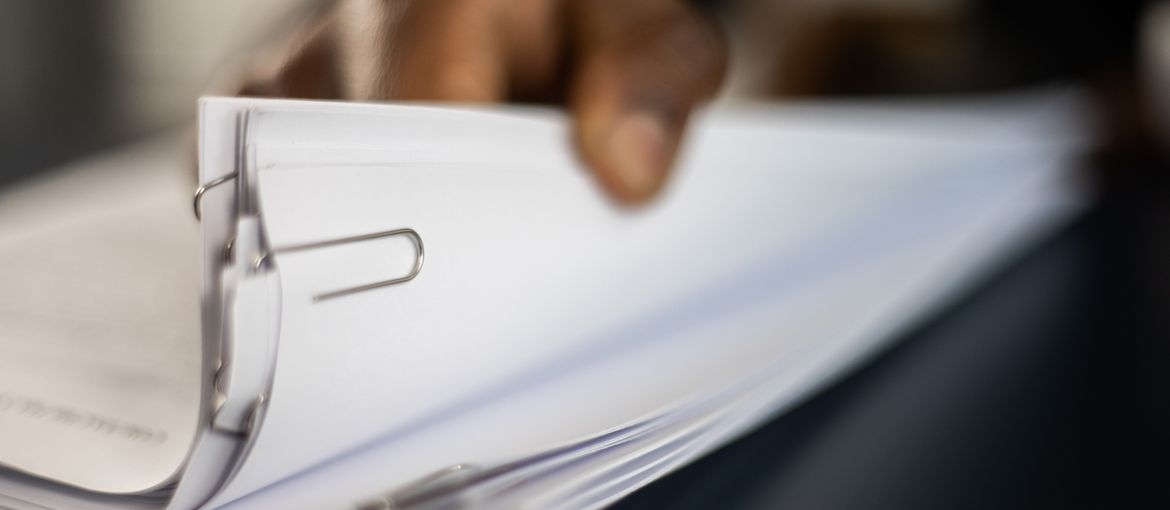 Person going through documents.