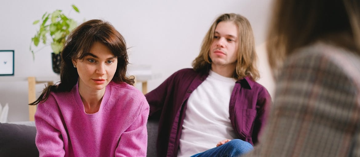 Couple discussing whether marriage can survive drug or alcohol addiction with their therapist.