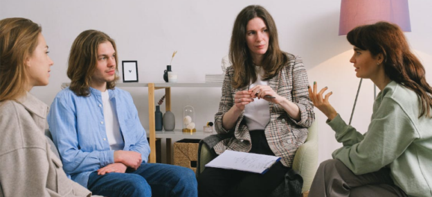 A family during a psychotherapy session, illustrating the need for family support in addiction recovery.