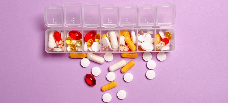 Pills in a white plastic container