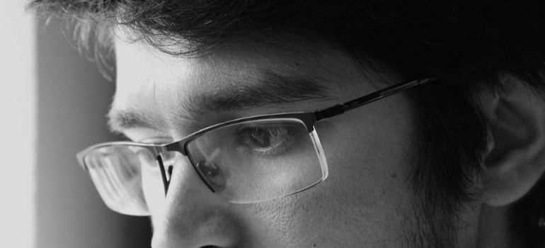 A close-up of a concerned man, illustrating psychological factors contributing to cocaine abuse.