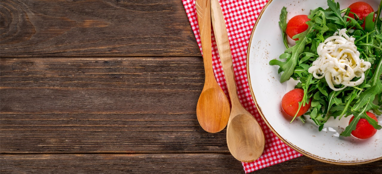 A close-up of a dish with greens and pasta, symbolizing the importance of nutrition in alcohol addiction treatment.