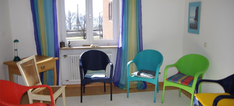 Colorful chairs in a circle.