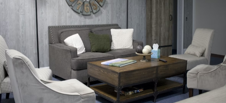 A cozy room with a sofa and armchairs, symbolizing family support in addiction recovery.