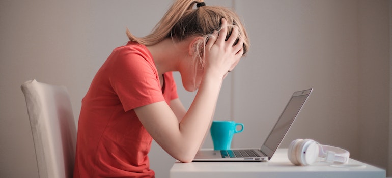 A woman looking at the laptop