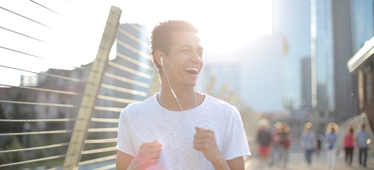 A man running outside and smiling