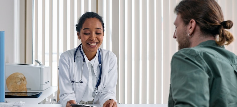 A doctor talking to a patient
