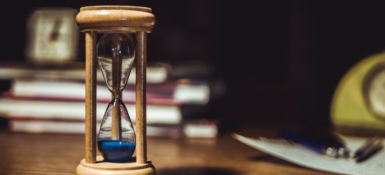 Hourglass with blue sand