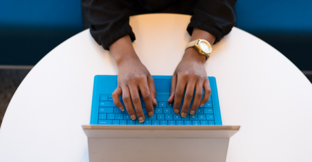 A person searching on their laptop about inpatient rehab success rates in WV.