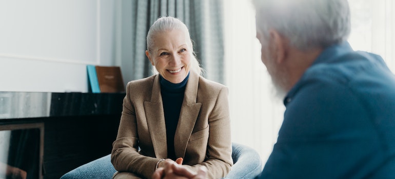 two older people talking to each other