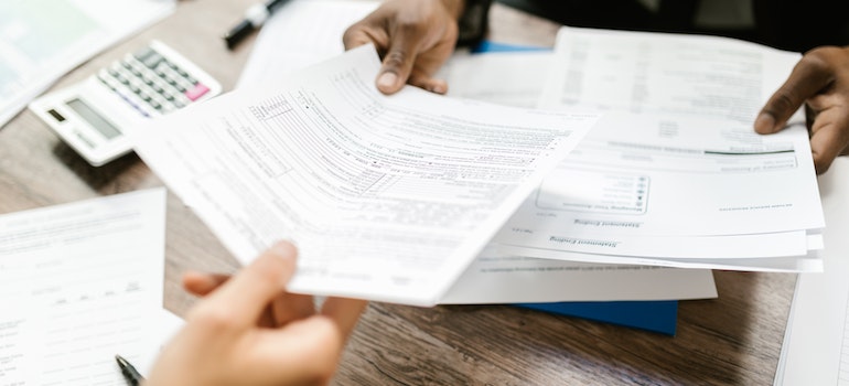 a patient discussing rehab insurance options with a healthcare provider
