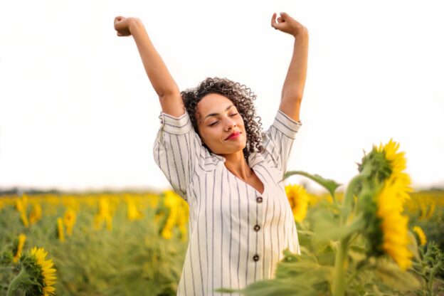 A happy person in the field of sunflowers