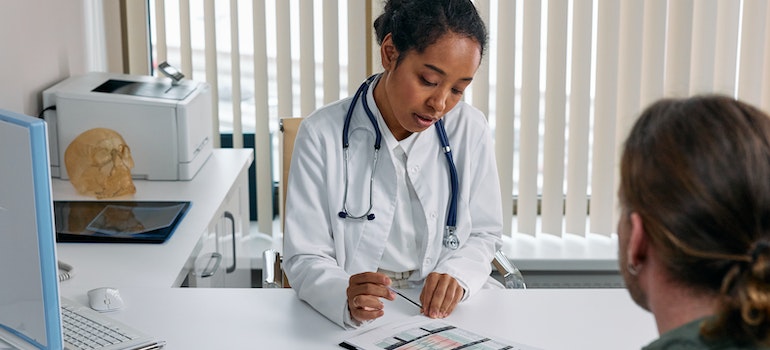 A doctor talking to a patient about key vitamins and supplements for meth recovery