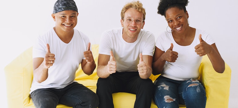 Three people on a couch, celebrating inpatient and outpatient rehab success rates in WV