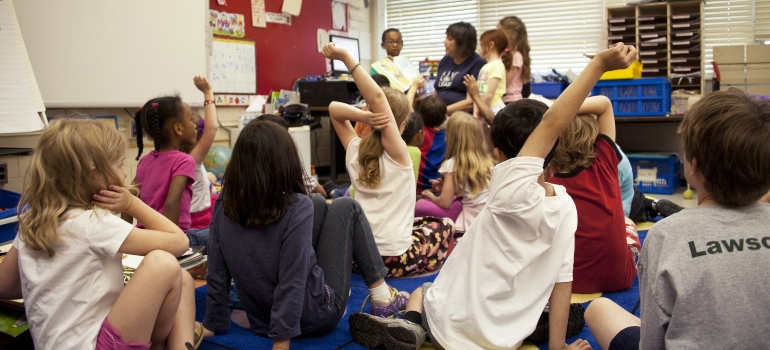 Teacher explaining to kids how food addiction is similar to drug addiction