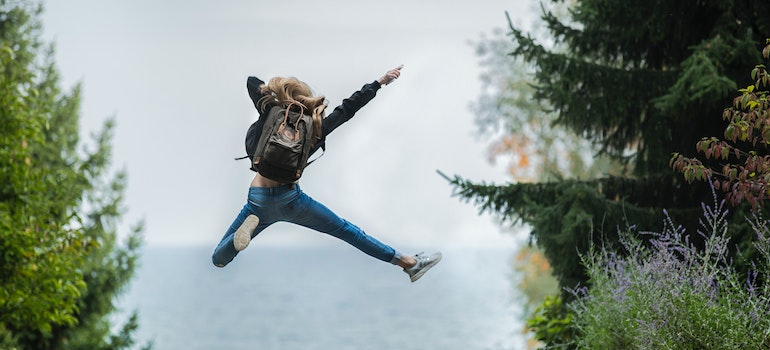 A person jumping in the air, showing happiness