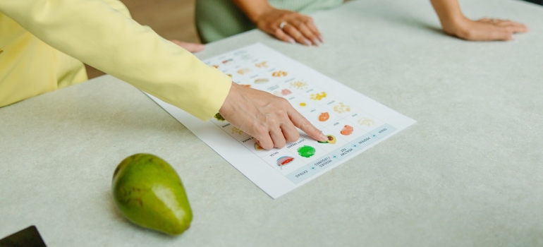 Nutritionist explaining to a client how food addiction is similar to drug addiction. Nutrition in addiction recovery