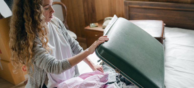 A woman unpacking for her rehab visit.