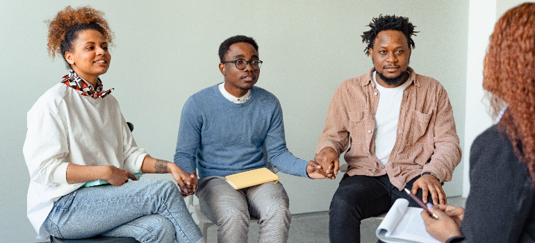 A group therapy session talking about your first week at rehab.