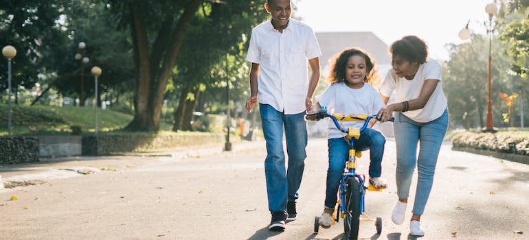 Parents having quality time with their daughter, as they are aware of relationship between substance abuse and parenting styles