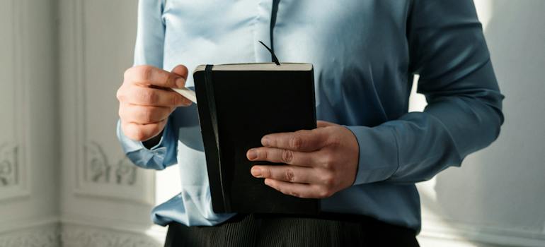 A therapist holding a notebook