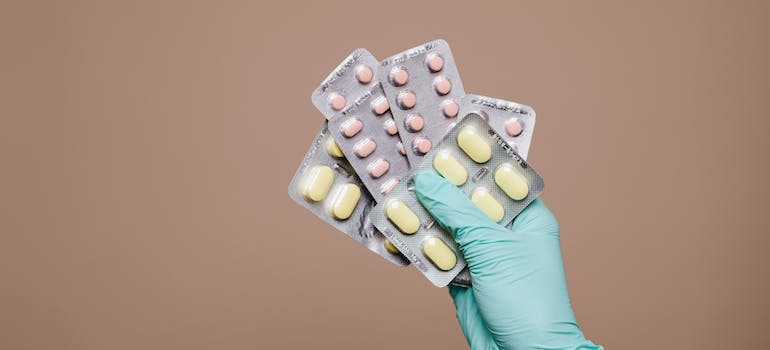 A doctor holding the correct dosage of Restoril in medication-assisted treatment in WV rehab centers