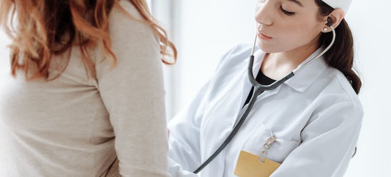 A doctor checking the patient