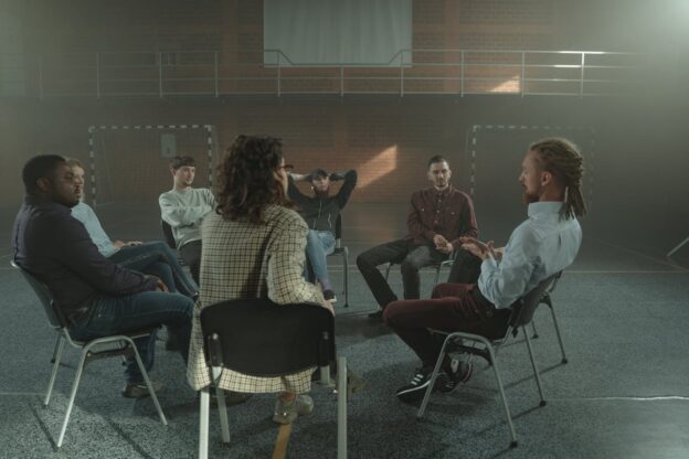 People in group therapy talking about why you don t have to be nervous for AA