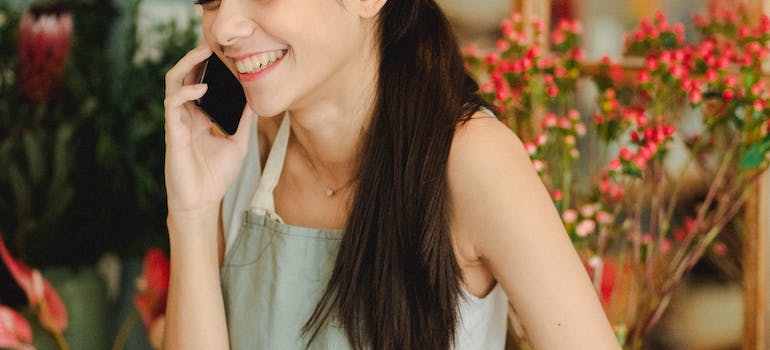 A girl holding a phone, visibly relieved after talking to a hotline counselor