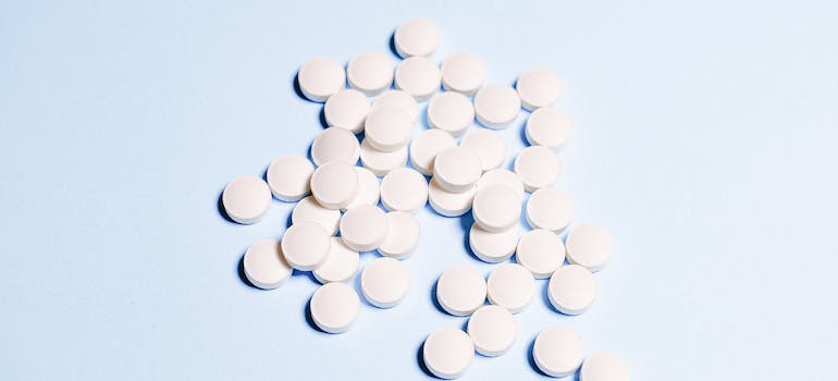 White pills on a blue background
