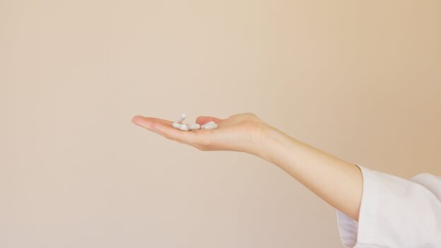 An open palm with medication in it