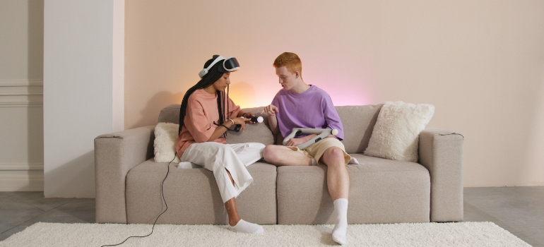 Two people with non-substance-related addictions in WV using a VR set