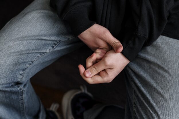 hands of a teenager illustrating the article Coping with a Child's Adderall Addiction in Parkersburg